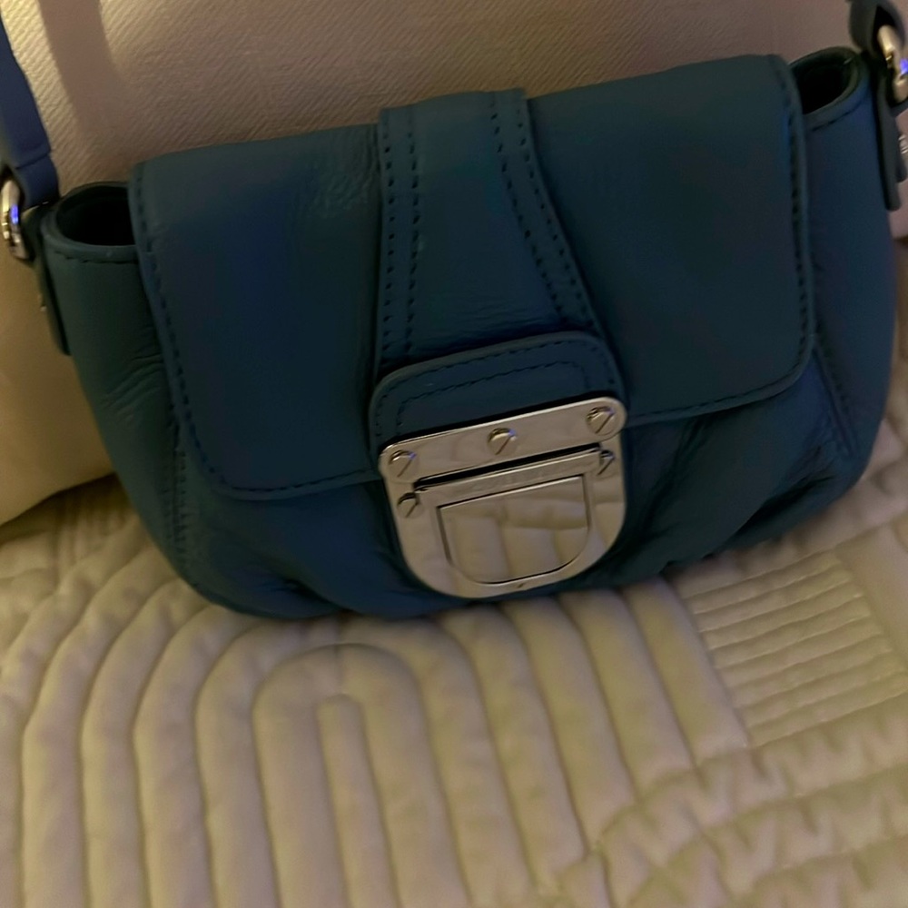 Crossbody by Michael Kors, all leather with silver hardware.
Used for an event .